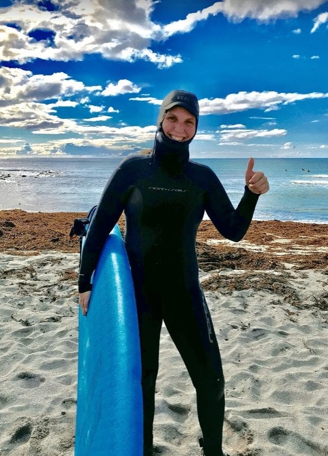My wife ready to surf in Unstad, Lofoten
