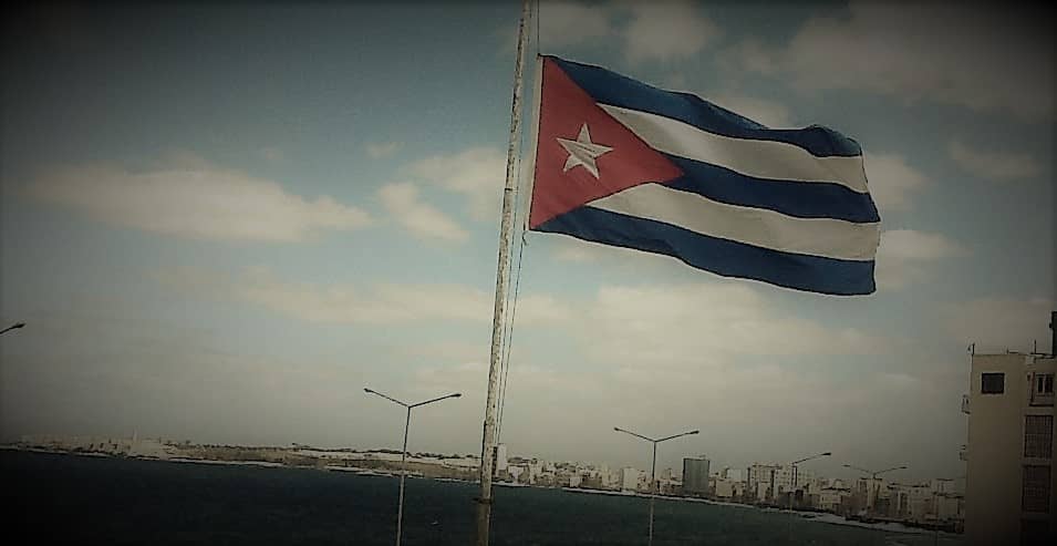 Politics and the ocean, represented by the Cuban flag outside Hotel Nacional, Havana